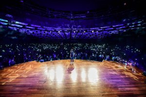 Photo of Kev Adams on stage during the Kev Adams comedy show 2019
